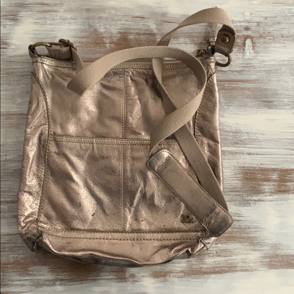 The sak gold purse